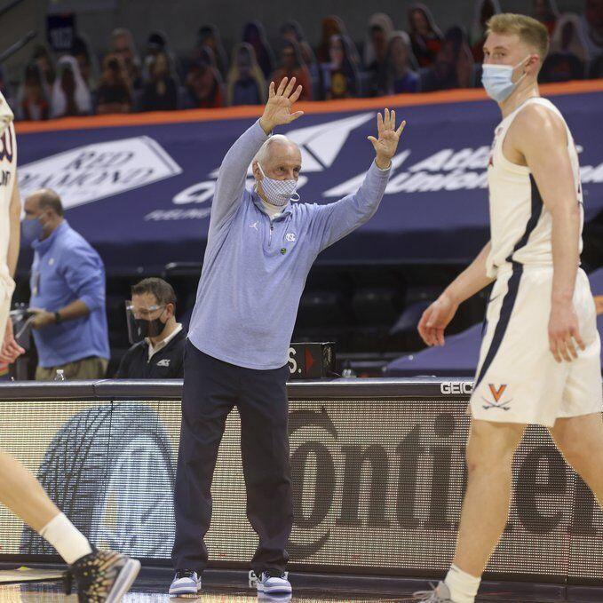 North Carolina coach Roy Williams waves goodbye